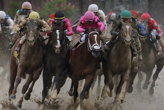 Flavien Prat on Country House, left, races against Luis Saez on Maximum Security, third from left, during the 145th running of the Kentucky Derby horse race at Churchill Downs Saturday, May 4, 2019, in Louisville, Ky. Maximum Security was disqualified and Country House won the race. (AP Photo/John Minchillo)