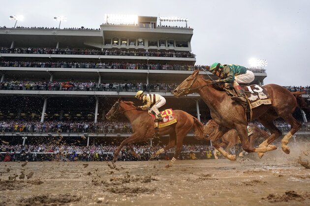 Flavien Prat rides Country House, left, to the finish line during the 145th running of the Kentucky Derby horse race at Churchill Downs Saturday, May 4, 2019, in Louisville, Ky. Country House was declared the winner after Maximum Security was disqualified following a review by race stewards.(AP Photo/Matt Slocum)