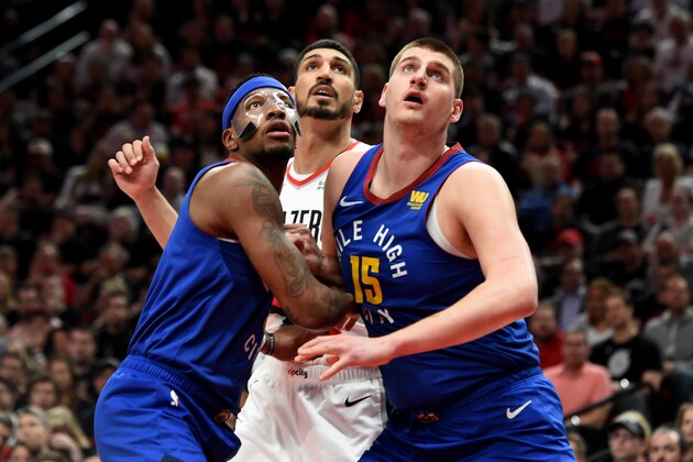 PORTLAND, OREGON - MAY 03: Torrey Craig #3 of the Denver Nuggets, Enes Kanter #00 of the Portland Trail Blazers and Nikola Jokic #15 of the Denver Nuggets battle for position during the first half of game three of the Western Conference Semifinals at Moda Center on May 03, 2019 in Portland, Oregon. NOTE TO USER: User expressly acknowledges and agrees that, by downloading and or using this photograph, User is consenting to the terms and conditions of the Getty Images License Agreement. (Photo by Steve Dykes/Getty Images)   (Photo by Steve Dykes/Getty Images)