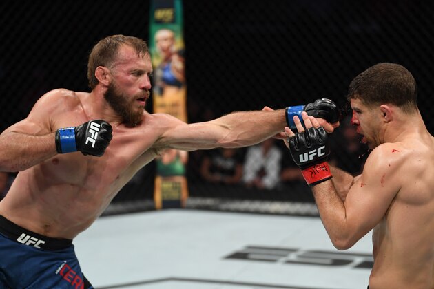 OTTAWA, ON - MAY 04:  (L-R) Donald Cerrone punches Al Iaquinta in their lightweight bout during the UFC Fight Night event at Canadian Tire Centre on May 4, 2019 in Ottawa, Ontario, Canada. (Photo by Jeff Bottari/Zuffa LLC/Zuffa LLC via Getty Images)