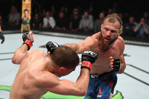 OTTAWA, ON - MAY 04:  (R-L) Donald Cerrone punches Al Iaquinta in their lightweight bout during the UFC Fight Night event at Canadian Tire Centre on May 4, 2019 in Ottawa, Ontario, Canada. (Photo by Jeff Bottari/Zuffa LLC/Zuffa LLC via Getty Images)