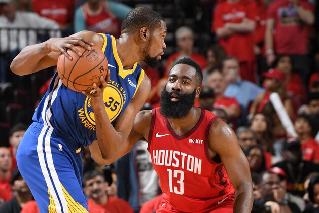 HOUSTON, TX - MAY 4: Kevin Durant #35 of the Golden State Warriors handles the ball against James Harden #13 of the Houston Rockets during Game Three of the Western Conference Semifinals of the 2019 NBA Playoffs on May 4, 2019 at the Toyota Center in Houston, Texas. NOTE TO USER: User expressly acknowledges and agrees that, by downloading and/or using this photograph, user is consenting to the terms and conditions of the Getty Images License Agreement. Mandatory Copyright Notice: Copyright 2019 NBAE (Photo by Andrew D. Bernstein/NBAE via Getty Images)