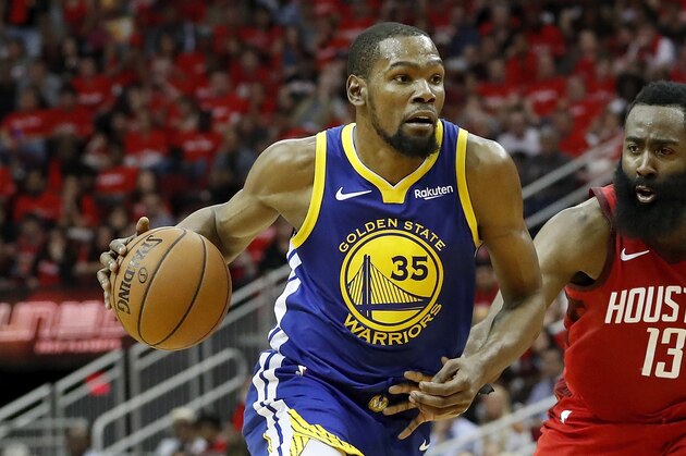 HOUSTON, TX - MAY 04:  Kevin Durant #35 of the Golden State Warriors drives to the basket defended by James Harden #13 of the Houston Rockets in the fourth quarter during Game Three of the Second Round of the 2019 NBA Western Conference Playoffs at Toyota Center on May 4, 2019 in Houston, Texas.  NOTE TO USER: User expressly acknowledges and agrees that, by downloading and or using this photograph, User is consenting to the terms and conditions of the Getty Images License Agreement.  (Photo by Tim Warner/Getty Images)