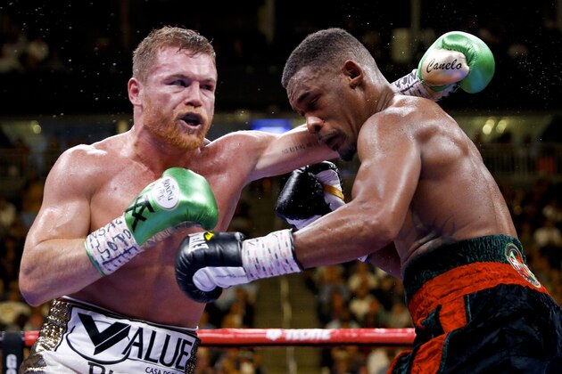 Canelo Alvarez, left, of Mexico, fights Daniel Jacobs in a middleweight title boxing match Saturday, May 4, 2019, in Las Vegas. (AP Photo/John Locher)