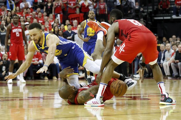 HOUSTON, TX - MAY 04:  PJ Tucker #17 of the Houston Rockets andStephen Curry #30 of the Golden State Warriors battle for a loose ball in the fourth quarter during Game Three of the Second Round of the 2019 NBA Western Conference Playoffs at Toyota Center on May 4, 2019 in Houston, Texas.  NOTE TO USER: User expressly acknowledges and agrees that, by downloading and or using this photograph, User is consenting to the terms and conditions of the Getty Images License Agreement.  (Photo by Tim Warner/Getty Images)