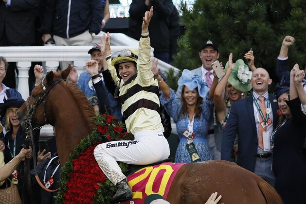 Flavien Prat celebrates after riding Country House to victory during the 145th running of the Kentucky Derby horse race at Churchill Downs Saturday, May 4, 2019, in Louisville, Ky. (AP Photo/John Minchillo)