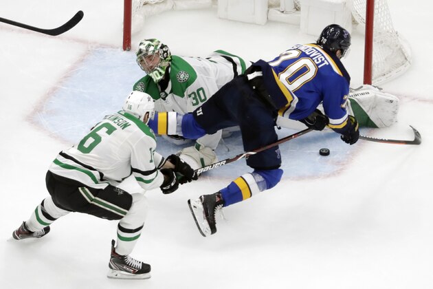 Dallas Stars goaltender Ben Bishop (30) blocks a shot by St. Louis Blues center Oskar Sundqvist (70), of Sweden, during the third period in Game 5 of an NHL second-round hockey playoff series Friday, May 3, 2019, in St. Louis. Also defending for the Stars is Jason Dickinson (16). The Stars won 2-1 and lead the series 3-2. (AP Photo/Jeff Roberson)