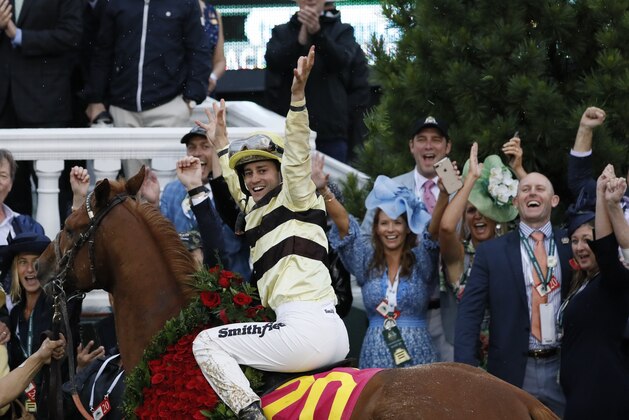 Flavien Prat celebrates after riding Country House to victory during the 145th running of the Kentucky Derby horse race at Churchill Downs Saturday, May 4, 2019, in Louisville, Ky. (AP Photo/John Minchillo)