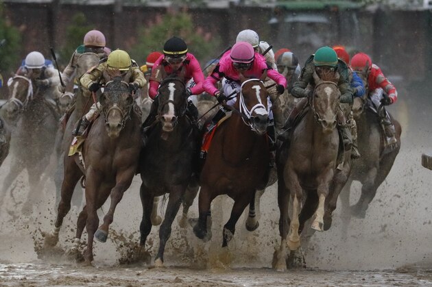 Luis Saez riding Maximum Security, second from right, goes around turn four with Flavien Prat riding Country House, left, Tyler Gaffalione riding War of Will and John Velazquez riding Code of Honor, right, during the 145th running of the Kentucky Derby horse race at Churchill Downs Saturday, May 4, 2019, in Louisville, Ky. (AP Photo/John Minchillo)