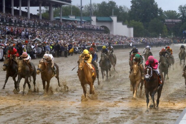 Luis Saez rides Maximum Security across the finish line first followed by Flavien Prat on Country House during the 145th running of the Kentucky Derby horse race at Churchill Downs Saturday, May 4, 2019, in Louisville, Ky. Country House was declared the winner after Maximum Security was disqualified following a review by race stewards. (AP Photo/Matt Slocum)