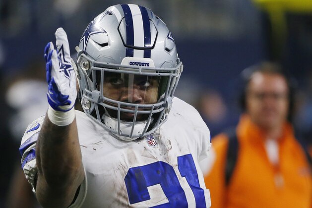 Dallas Cowboys running back Ezekiel Elliott (21) signals a first down after long run in the first half of the NFC wild-card NFL football game against the Seattle Seahawks, in Arlington, Texas, Saturday, Jan. 5, 2019. (AP Photo/Ron Jenkins)