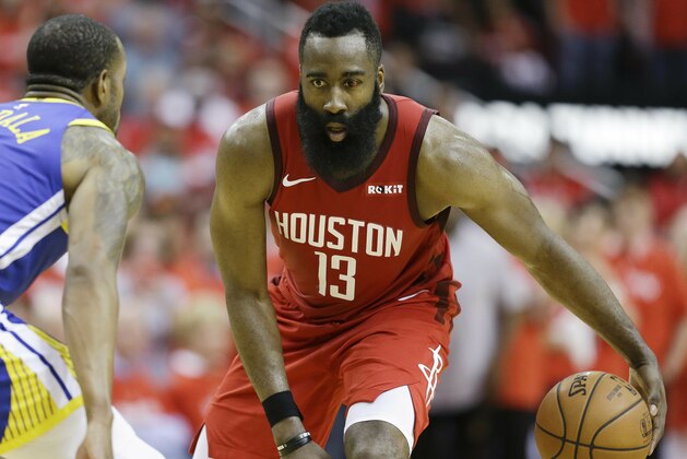 Houston Rockets guard James Harden (13) dribbles as Golden State Warriors guard Andre Iguodala defends during the second half of Game 3 of a second-round NBA basketball playoff series, Saturday, May 4, 2019, in Houston. (AP Photo/Eric Christian Smith)