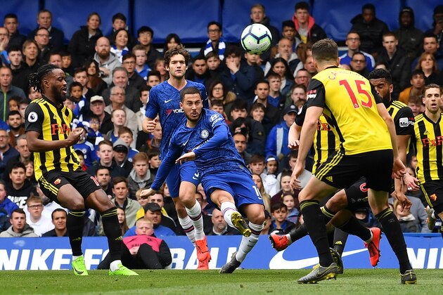 Chelsea's Belgian midfielder Eden Hazard (C) shoots but fails to score during the English Premier League football match between Chelsea and Watford at Stamford Bridge in London on May 5, 2019. (Photo by Ben STANSALL / AFP) / RESTRICTED TO EDITORIAL USE. No use with unauthorized audio, video, data, fixture lists, club/league logos or 'live' services. Online in-match use limited to 120 images. An additional 40 images may be used in extra time. No video emulation. Social media in-match use limited to 120 images. An additional 40 images may be used in extra time. No use in betting publications, games or single club/league/player publications. /         (Photo credit should read BEN STANSALL/AFP/Getty Images)