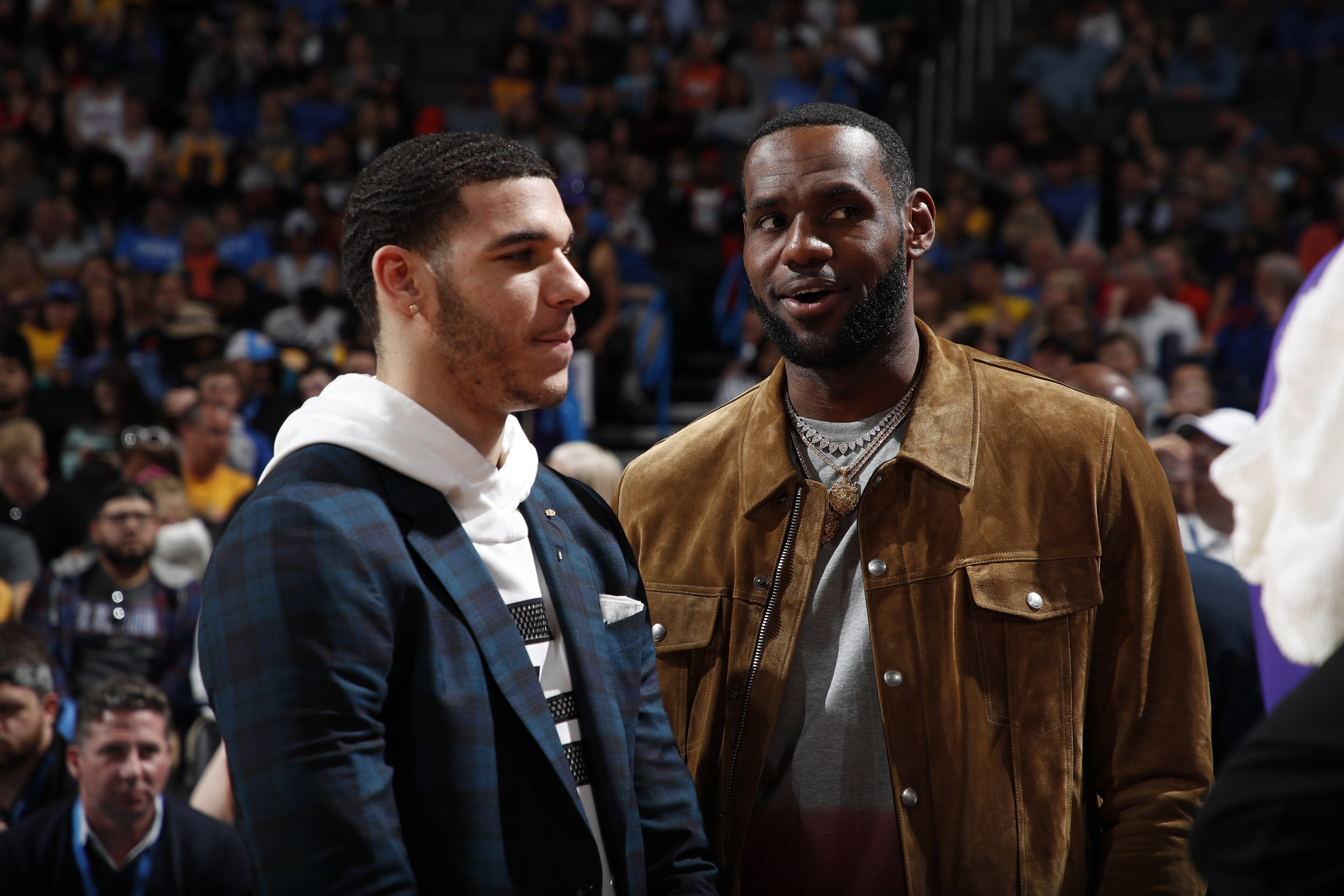 OKLAHOMA CITY, OK- APRIL 2: LeBron James #23 and Lonzo Ball #2 of the Los Angeles Lakers talk during a game against the Oklahoma City Thunder on April 2, 2019 at Chesapeake Energy Arena in Oklahoma City, Oklahoma. NOTE TO USER: User expressly acknowledges and agrees that, by downloading and or using this photograph, User is consenting to the terms and conditions of the Getty Images License Agreement. Mandatory Copyright Notice: Copyright 2019 NBAE (Photo by Jeff Haynes/NBAE via Getty Images)