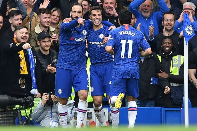 Chelsea's Argentinian striker Gonzalo Higuain (L) celebrates scoring his team's third goal with Chelsea's Spanish defender Cesar Azpilicueta (C) and Chelsea's Spanish midfielder Pedro during the English Premier League football match between Chelsea and Watford at Stamford Bridge in London on May 5, 2019. (Photo by Ben STANSALL / AFP) / RESTRICTED TO EDITORIAL USE. No use with unauthorized audio, video, data, fixture lists, club/league logos or 'live' services. Online in-match use limited to 120 images. An additional 40 images may be used in extra time. No video emulation. Social media in-match use limited to 120 images. An additional 40 images may be used in extra time. No use in betting publications, games or single club/league/player publications. /         (Photo credit should read BEN STANSALL/AFP/Getty Images)