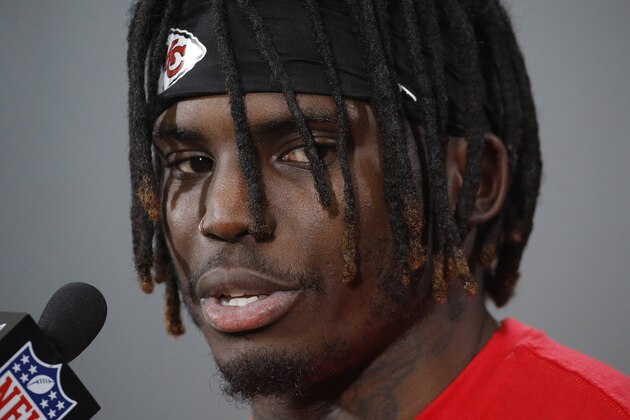 FILE - In this Jan. 18, 2019, file photo, Kansas City Chiefs wide receiver Tyreek Hill talks to the media after a workout in Kansas City, Mo. The Kansas City Chiefs have made a habit of inciting controversy during the NFL draft in the Andy Reid era by acquiring players that have a history of off-the-field issues. The team took a chance on cornerback Marcus Peters, who was traded away after getting into trouble with coaches. It drafted running back Kareem Hunt, then quickly cut him when he kicked a woman in a hotel hallway. And it picked wide receiver Tyreek Hill, who is currently dealing with a domestic violence case that centers on the 3-year-old child he shares with his fiance. (AP Photo/Charlie Riedel, File)