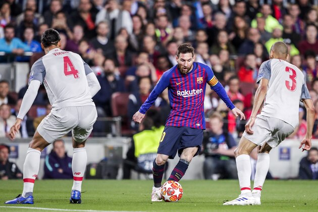 BARCELONA, SPAIN - MAY 1: (L-R) Virgil van Dijk of Liverpool FC, Lionel Messi of FC Barcelona, Fabinho of Liverpool FC during the UEFA Champions League  match between FC Barcelona v Liverpool at the Camp Nou on May 1, 2019 in Barcelona Spain (Photo by David S. Bustamante/Soccrates/Getty Images)