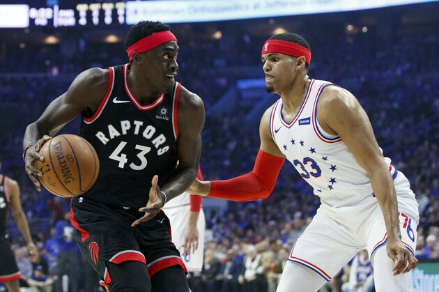 Toronto Raptors' Pascal Siakam, left, looks to make a move against Philadelphia 76ers' Tobias Harris during the first half of Game 3 of a second-round NBA basketball playoff series Thursday, May 2, 2019, in Philadelphia. (AP Photo/Chris Szagola)
