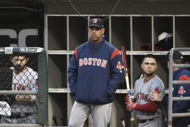 CHICAGO, ILLINOIS - MAY 02: Alex Cora #20 of the Boston Red Sox in the dugout at Guaranteed Rate Field on May 02, 2019 in Chicago, Illinois. (Photo by David Banks/Getty Images)