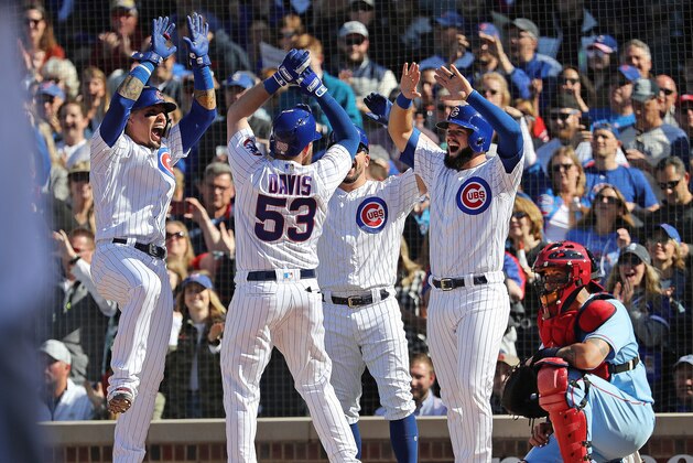 CHICAGO, ILLINOIS - MAY 04: Taylor Davis #53 of the Chicago Cubs is congratulated by teammates at the home plate following his grand slam during the fourth inning of a game against the St. Louis Cardinals at Wrigley Field on May 04, 2019 in Chicago, Illinois. (Photo by Nuccio DiNuzzo/Getty Images)