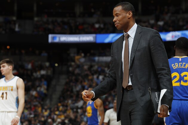 Golden State Warriors assistant coach Jarron Collins in the first half of an NBA basketball game Monday, Feb. 13, 201, in Denver. (AP Photo/David Zalubowski)