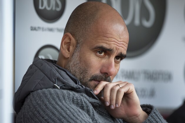 BURNLEY, ENGLAND - APRIL 28: Manchester City manager Pep Guardiola waits in the away team dugout before the Premier League match between Burnley FC and Manchester City at Turf Moor on April 28, 2019 in Burnley, United Kingdom. (Photo by Visionhaus/Getty Images)