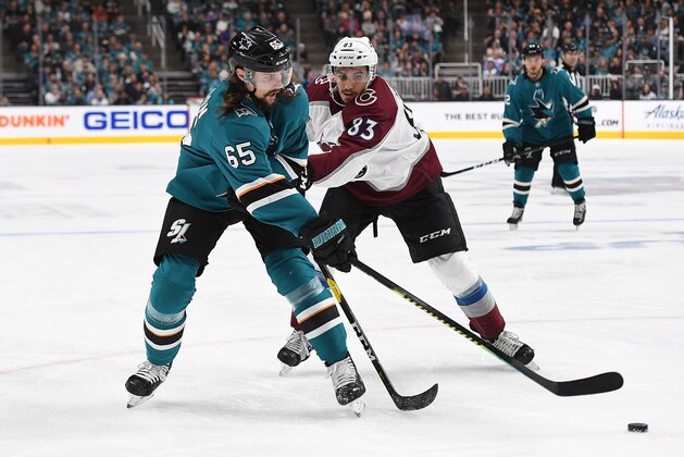 SAN JOSE, CA - MAY 04:  Erik Karlsson #65 of the San Jose Sharks gets his pass by the stick of Matt Nieto #83 of the Colorado Avalanche during the second period in Game Five of the Western Conference Second Round during the 2019 NHL Stanley Cup Playoffs at SAP Center on May 4, 2019 in San Jose, California.  (Photo by Thearon W. Henderson/Getty Images)