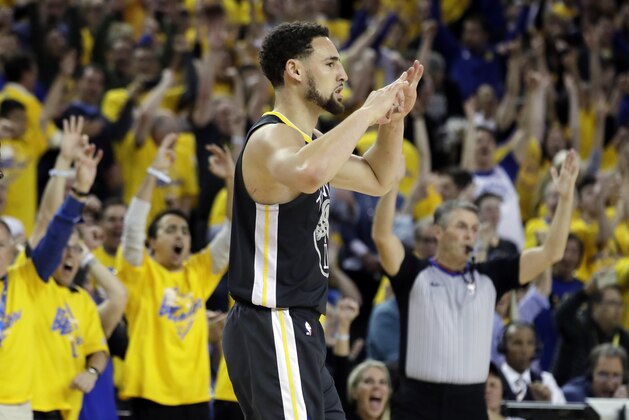 Golden State Warriors' Klay Thompson reacts after making a 3-point basket against the Houston Rockets during the second half in Game 2 of a second-round NBA basketball playoff series in Oakland, Calif., Tuesday, April 30, 2019. (AP Photo/Jeff Chiu)