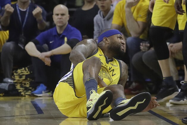 Golden State Warriors center DeMarcus Cousins reacts after falling to the floor during the first half of Game 2 of a first-round NBA basketball playoff series against the Los Angeles Clippers in Oakland, Calif., Monday, April 15, 2019. (AP Photo/Jeff Chiu)