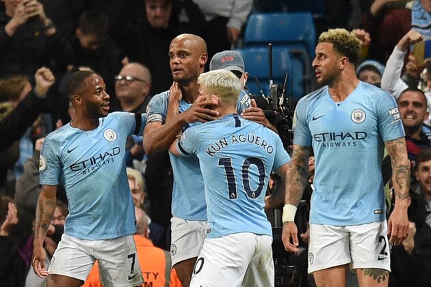 Manchester City's Belgian defender Vincent Kompany (2L) celebrates scoring the opening goal during the English Premier League football match between Manchester City and Leicester City at the Etihad Stadium in Manchester, north west England, on May 6, 2019. (Photo by Oli SCARFF / AFP) / RESTRICTED TO EDITORIAL USE. No use with unauthorized audio, video, data, fixture lists, club/league logos or 'live' services. Online in-match use limited to 120 images. An additional 40 images may be used in extra time. No video emulation. Social media in-match use limited to 120 images. An additional 40 images may be used in extra time. No use in betting publications, games or single club/league/player publications. /         (Photo credit should read OLI SCARFF/AFP/Getty Images)