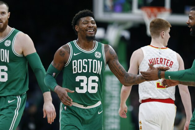Boston Celtics' Marcus Smart (36) reacts during the first half of an NBA basketball game against the Atlanta Hawks in Boston, Saturday, March 16, 2019. (AP Photo/Michael Dwyer)