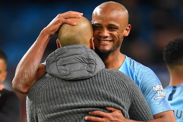 MANCHESTER, ENGLAND - MAY 06:  Vincent Kompany and Josep Guardiola, Manager of Manchester City celebrate after the Premier League match between Manchester City and Leicester City at Etihad Stadium on May 06, 2019 in Manchester, United Kingdom. (Photo by Michael Regan/Getty Images)