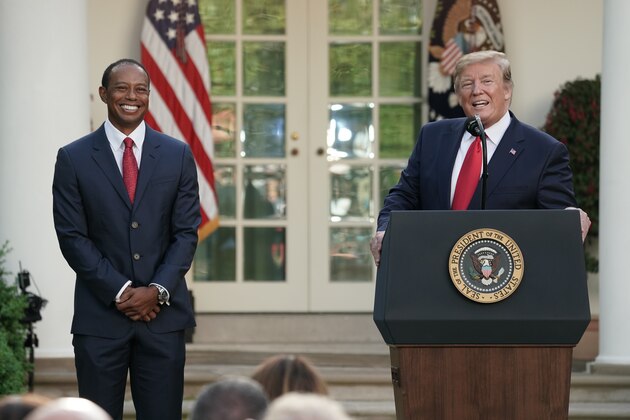 WASHINGTON, DC - MAY 06: U.S. President Donald Trump speaks as professional golfer and business partner Tiger Woods looks on during the Medal of Freedom ceremony in the Rose Garden at the White House May 06, 2019 in Washington, DC. Trump announced he would give the nation’s highest civilian honor to Woods, 43, in honor of his Masters victory last month.  (Photo by Chip Somodevilla/Getty Images)
