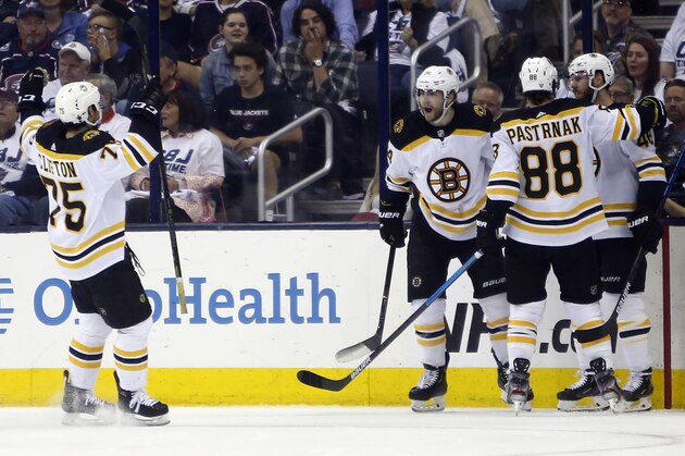 Boston Bruins players celebrate their goal against the Columbus Blue Jackets during the second period of Game 6 of an NHL hockey second-round playoff series Monday, May 6, 2019, in Columbus, Ohio. (AP Photo/Jay LaPrete)