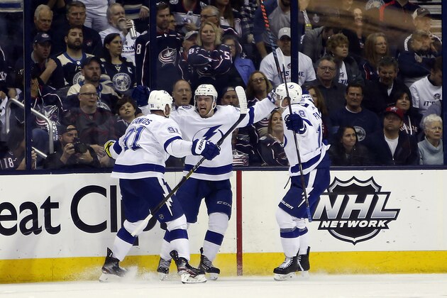 Tampa Bay Lightning's Steven Stamkos, left to right, Brayden Point and Ondrej Palat, of the Czech Republic, celebrate their goal against the Columbus Blue Jackets during the second period of Game 4 of an NHL hockey first-round playoff series, Tuesday, April 16, 2019, in Columbus, Ohio. (AP Photo/Jay LaPrete)