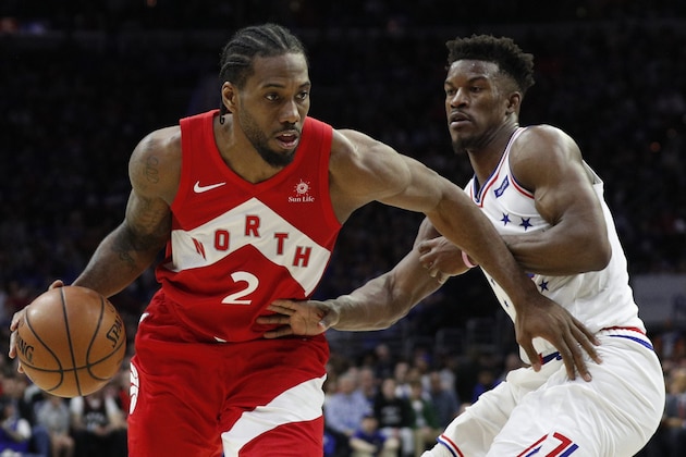 Toronto Raptors' Kawhi Leonard, left, drives against Philadelphia 76ers' Jimmy Butler, right, during the second half of Game 4 of a second-round NBA basketball playoff series, Sunday, May 5, 2019, in Philadelphia. The Raptors won 101-96. (AP Photo/Chris Szagola)