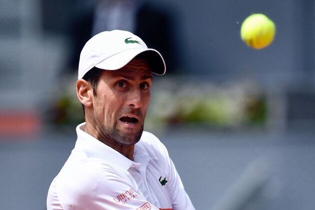 Serbia's Novak Djokovic returns the ball to US Taylor Fritz during their ATP Madrid Open round of 64 tennis match at the Caja Magica in Madrid on May 7, 2019. (Photo by OSCAR DEL POZO / AFP)        (Photo credit should read OSCAR DEL POZO/AFP/Getty Images)