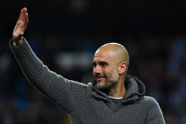 Manchester City's Spanish manager Pep Guardiola takes part in a lap of appreciation after the final whistle of the English Premier League football match between Manchester City and Leicester City at the Etihad Stadium in Manchester, north west England, on May 6, 2019. (Photo by Paul ELLIS / AFP) / RESTRICTED TO EDITORIAL USE. No use with unauthorized audio, video, data, fixture lists, club/league logos or 'live' services. Online in-match use limited to 120 images. An additional 40 images may be used in extra time. No video emulation. Social media in-match use limited to 120 images. An additional 40 images may be used in extra time. No use in betting publications, games or single club/league/player publications. /         (Photo credit should read PAUL ELLIS/AFP/Getty Images)