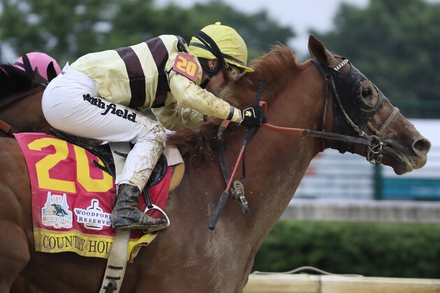 LOUISVILLE, KENTUCKY - MAY 04: Country House #20, ridden by jockey Flavien Prat, heads down the stretch on his way to winning the 145th running of the Kentucky Derby at Churchill Downs on May 04, 2019 in Louisville, Kentucky. Country House #20 was declared the winner after a stewards review disqualified Maximum Security #7. (Photo by Andy Lyons/Getty Images)