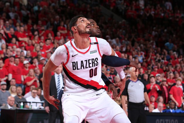 PORTLAND, OR - MAY 5: Enes Kanter #00 of the Portland Trail Blazers and Paul Millsap #4 of the Denver Nuggets fights for position to grab the rebound during Game Four of the Western Conference Semifinals of the 2019 NBA Playoffs on May 5, 2019 at the Moda Center Arena in Portland, Oregon. NOTE TO USER: User expressly acknowledges and agrees that, by downloading and or using this photograph, user is consenting to the terms and conditions of the Getty Images License Agreement. Mandatory Copyright Notice: Copyright 2019 NBAE (Photo by Sam Forencich/NBAE via Getty Images)