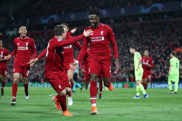 LIVERPOOL, ENGLAND - MAY 07:  Divock Origi of Liverpool (27) celebrates as he scores his team's fourth goal with Xherdan Shaqiri and team mates during the UEFA Champions League Semi Final second leg match between Liverpool and Barcelona at Anfield on May 07, 2019 in Liverpool, England. (Photo by Clive Brunskill/Getty Images)