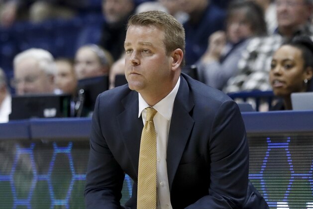 Marquette head coach Steve Wojciechowski works the bench in the second half of an NCAA college basketball game against Xavier, Wednesday, March 1, 2017, in Cincinnati. Marquette won 95-84. (AP Photo/John Minchillo)