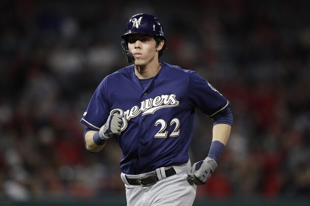 Milwaukee Brewers' Christian Yelich heads back to first base during the seventh inning of a baseball game against the Los Angeles Angels, Wednesday, April 10, 2019, in Anaheim, Calif. (AP Photo/Jae C. Hong)