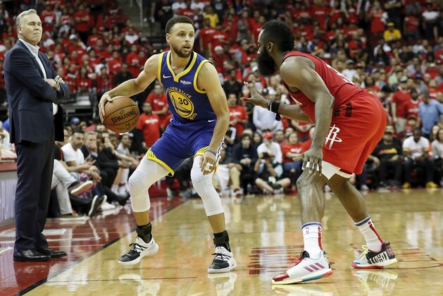 HOUSTON, TX - MAY 04:  Stephen Curry #30 of the Golden State Warriors dribbles the ball defended by James Harden #13 of the Houston Rockets in overtime during Game Three of the Second Round of the 2019 NBA Western Conference Playoffs at Toyota Center on May 4, 2019 in Houston, Texas.  NOTE TO USER: User expressly acknowledges and agrees that, by downloading and or using this photograph, User is consenting to the terms and conditions of the Getty Images License Agreement.  (Photo by Tim Warner/Getty Images)