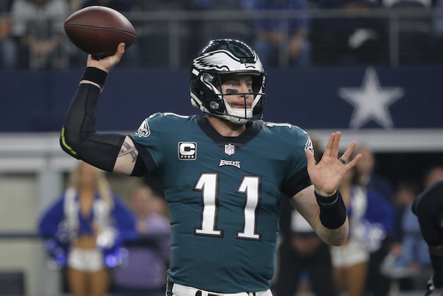 Philadelphia Eagles quarterback Carson Wentz (11) throws against the Dallas Cowboys during the first half of an NFL football game, in Arlington, Texas, Sunday, Dec. 9, 2018. (AP Photo/Michael Ainsworth)