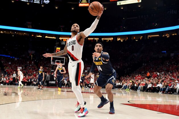 PORTLAND, OREGON - MAY 05: Damian Lillard #0 of the Portland Trail Blazers grabs a inbounds pass in front of Gary Harris #14 of the Denver Nuggets during the second half of game four of the Western Conference Semifinals at Moda Center on May 05, 2019 in Portland, Oregon. The Nuggets won 116-112. NOTE TO USER: User expressly acknowledges and agrees that, by downloading and or using this photograph, User is consenting to the terms and conditions of the Getty Images License Agreement. (Photo by Steve Dykes/Getty Images)