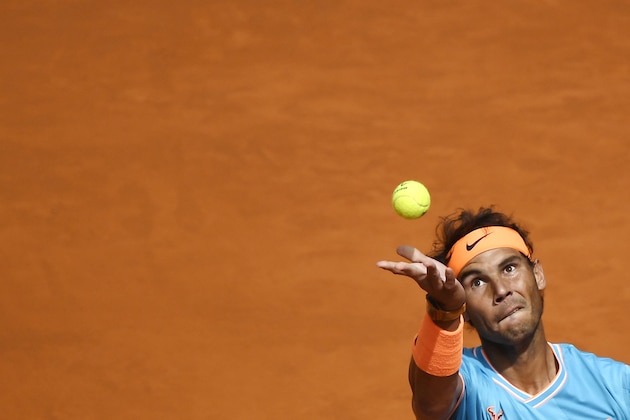 Spain's Rafael Nadal serves the ball to Canada's Felix Auger Aliassime during their ATP Madrid Open round of 32 tennis match at the Caja Magica in Madrid on May 8, 2019. (Photo by Pierre-Philippe MARCOU / AFP)        (Photo credit should read PIERRE-PHILIPPE MARCOU/AFP/Getty Images)