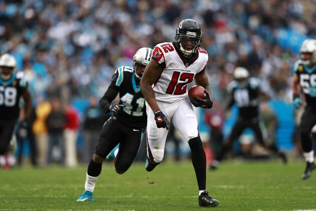 Atlanta Falcons' Mohamed Sanu (12) runs for a touchdown after a catch against the Carolina Panthers during the second half of an NFL football game in Charlotte, N.C., Sunday, Dec. 23, 2018. (AP Photo/Jason E. Miczek)
