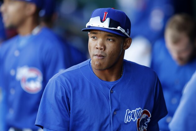 Iowa Cubs shortstop Addison Russell walks in the dugout before a Triple-A baseball game against the Nashville Sounds, Wednesday, April 24, 2019, in Des Moines, Iowa. Russell played in his first game of the season Wednesday for Iowa as he prepares to return to the Chicago Cubs following his domestic violence suspension. (AP Photo/Charlie Neibergall)