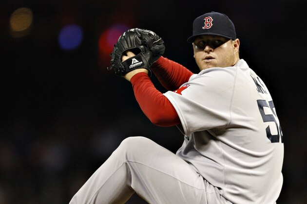 HOUSTON - JULY 02:  Pitcher Bobby Jenks #52 throws in the eighth inning against the Houston Astros at Minute Maid Park on July 2, 2011 in Houston, Texas. Boston won 10-4. (Photo by Bob Levey/Getty Images)
